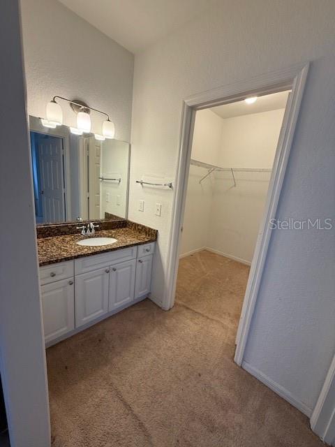 3701 Conroy Road, Unit 1822 Orlando, FL 32839 - Photo 15 of 23 a kitchen with refrigerator and cabinets