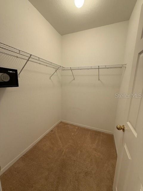 3701 Conroy Road, Unit 1822 Orlando, FL 32839 - Photo 16 of 23 a view of a room with racks on the wall