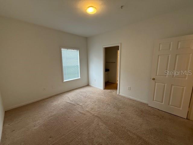 3701 Conroy Road, Unit 1822 Orlando, FL 32839 - Photo 19 of 23 a view of an empty room with a window