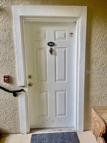 a bathroom with a shower a toilet and a window