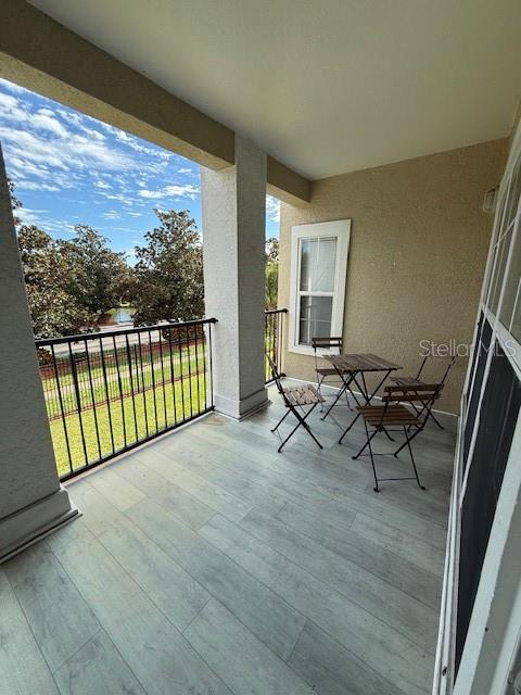 3701 Conroy Road, Unit 1822 Orlando, FL 32839 - Photo 21 of 23 a view of a porch with furniture and garden