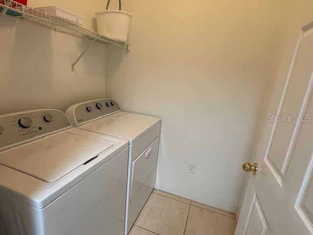 3701 Conroy Road, Unit 1822 Orlando, FL 32839 - Photo 8 of 23 a utility room with dryer and washer
