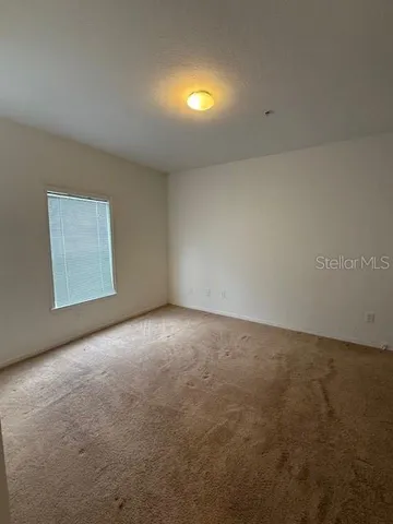 an empty room with a empty space and window