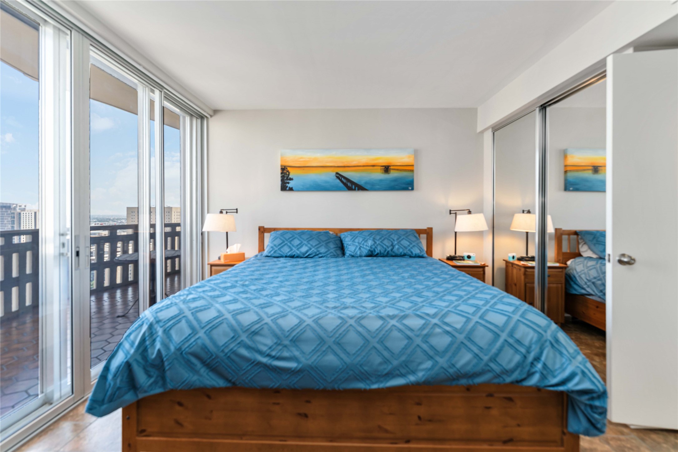 2016 Main Street, Unit 2305 Houston, TX 77002 - Photo 14 of 26 a bedroom with a bed and a painting on the wall