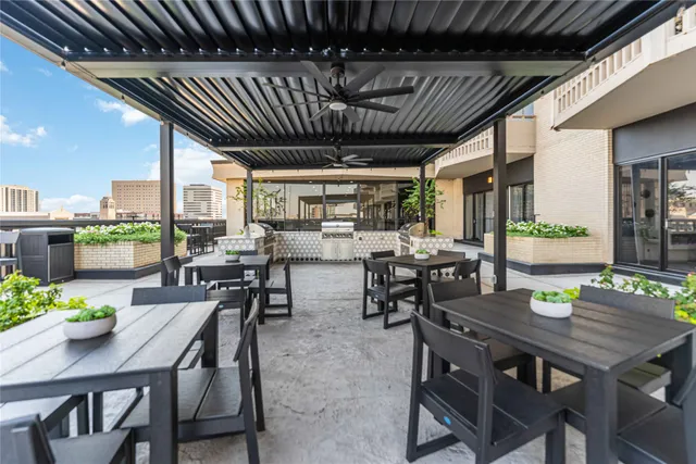 a dining room with furniture a rug and wooden floor