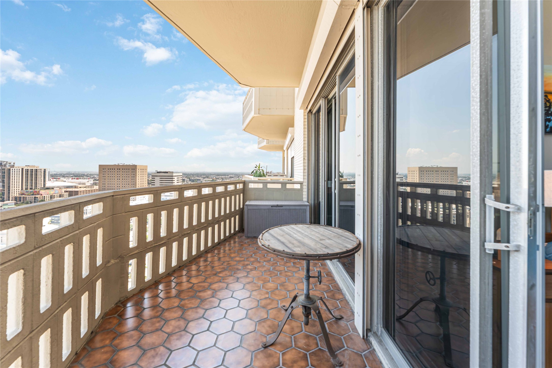2016 Main Street, Unit 2305 Houston, TX 77002 - Photo 4 of 26 a view of a balcony with chair and table