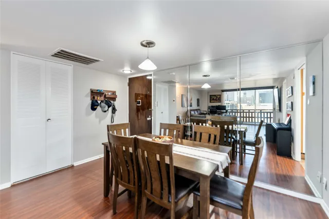 a view of a dining area with furniture and wooden floor