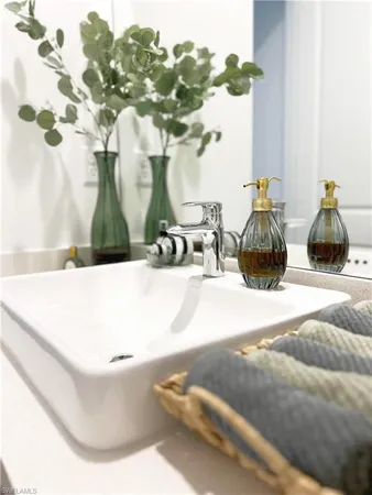 a bathroom with a sink and mirror