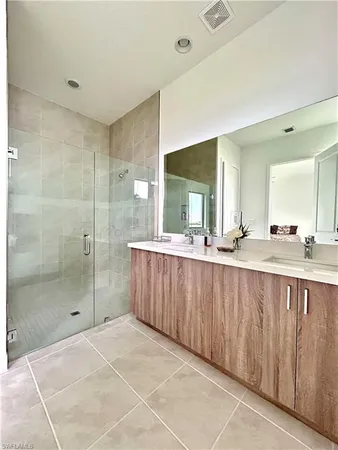 a white toilet sitting next to a white sink