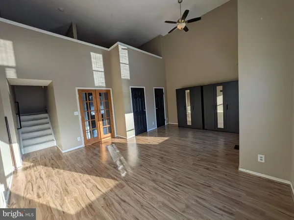 wooden floor in an empty room with a fireplace