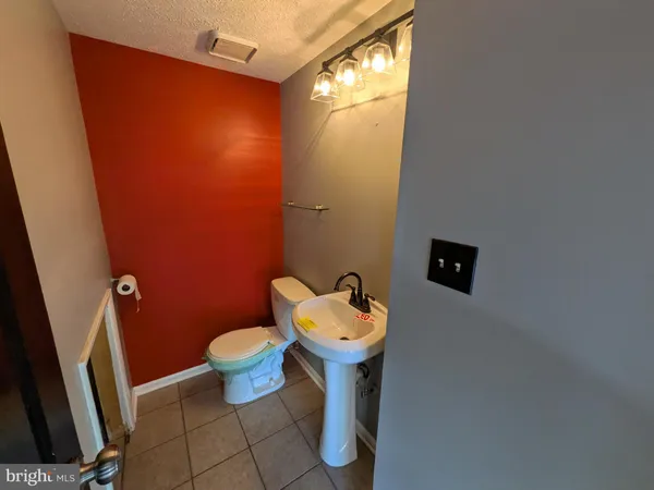 a bathroom with a toilet and a sink