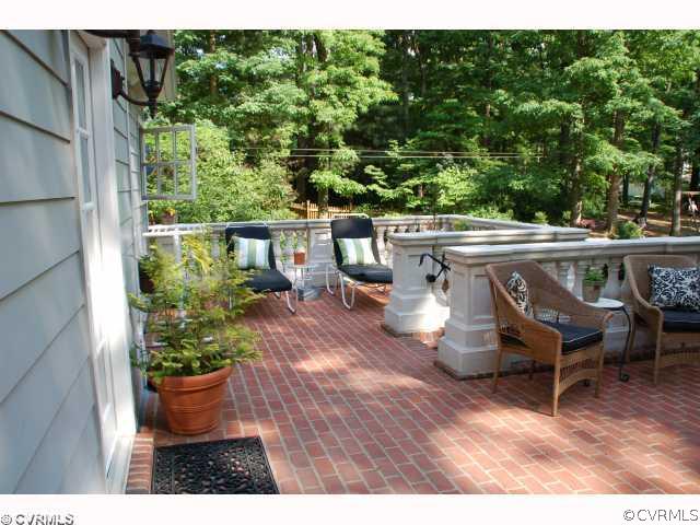 13421 Kingsmill Road Midlothian, VA 23113 - Photo 3 of 12 a view of a patio with table and chairs potted plants with wooden floor