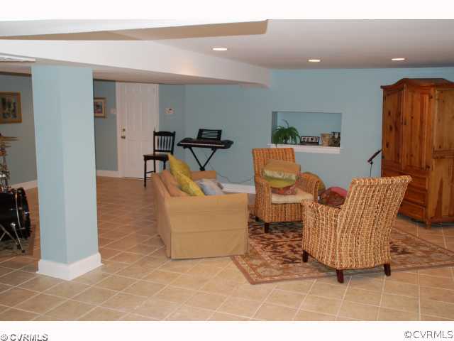 13421 Kingsmill Road Midlothian, VA 23113 - Photo 10 of 12 a living room with furniture and wooden floor