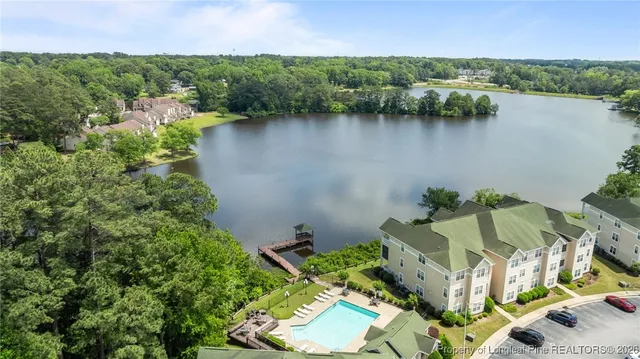 an aerial view of residential house with outdoor space and lake view
