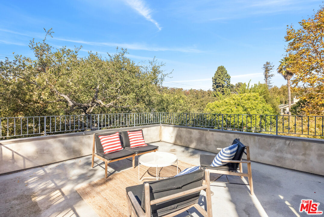 8 Latimer Road Santa Monica, CA 90402 - Photo 1 of 1 a view of a patio with swimming pool and sitting area