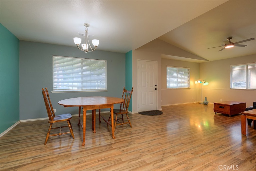 2732 Lowell Drive Chico, CA 95973 - Photo 16 of 40 a view of a dining room with furniture wooden floor and chandelier