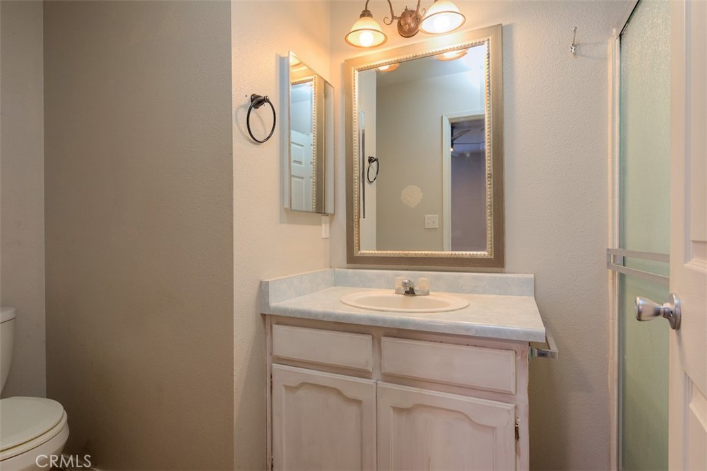 2732 Lowell Drive Chico, CA 95973 - Photo 20 of 40 a bathroom with a sink a toilet and a mirror