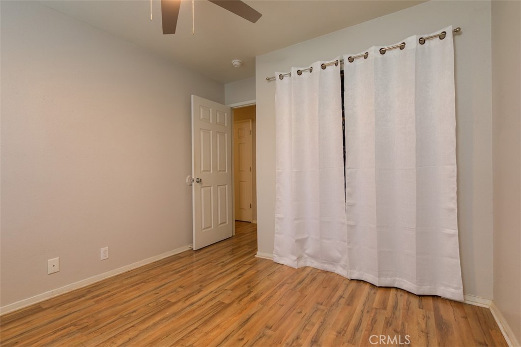 2732 Lowell Drive Chico, CA 95973 - Photo 23 of 40 a view of a room with wooden floor and a curtain
