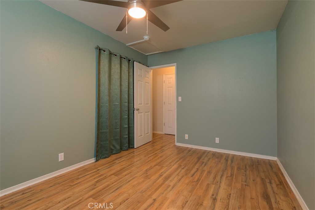 2732 Lowell Drive Chico, CA 95973 - Photo 25 of 40 an empty room with wooden floor and windows