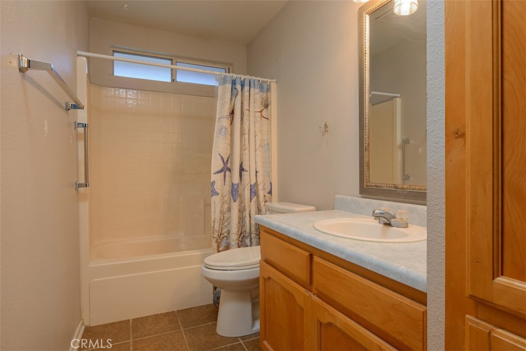 2732 Lowell Drive Chico, CA 95973 - Photo 26 of 40 a bathroom with a granite countertop sink toilet and shower