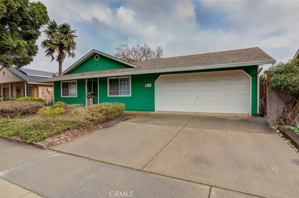 2732 Lowell Drive Chico, CA 95973 - Photo 39 of 40 a front view of a house with a yard and garage