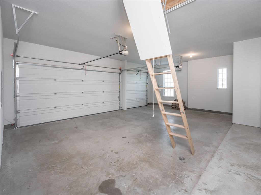 2108 Charters Circle Nevada, TX 75173 - Photo 3 of 37 Garage with a garage door opener