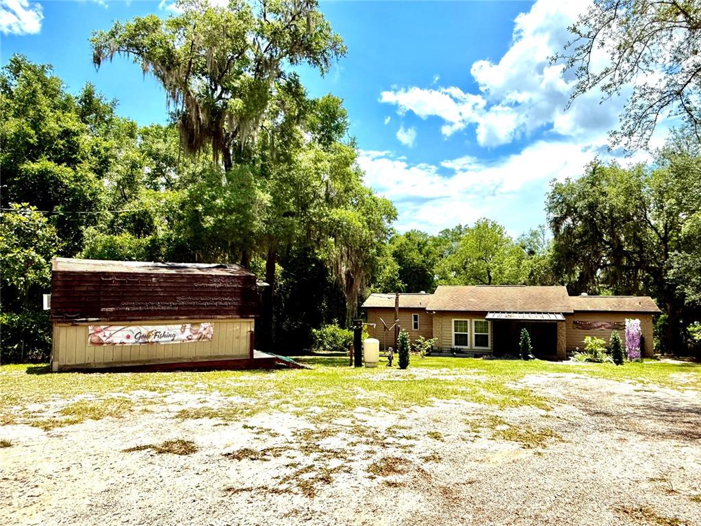 208 Ashley Street Hawthorne, FL 32640 - Photo 25 of 32 a front view of a house with a yard