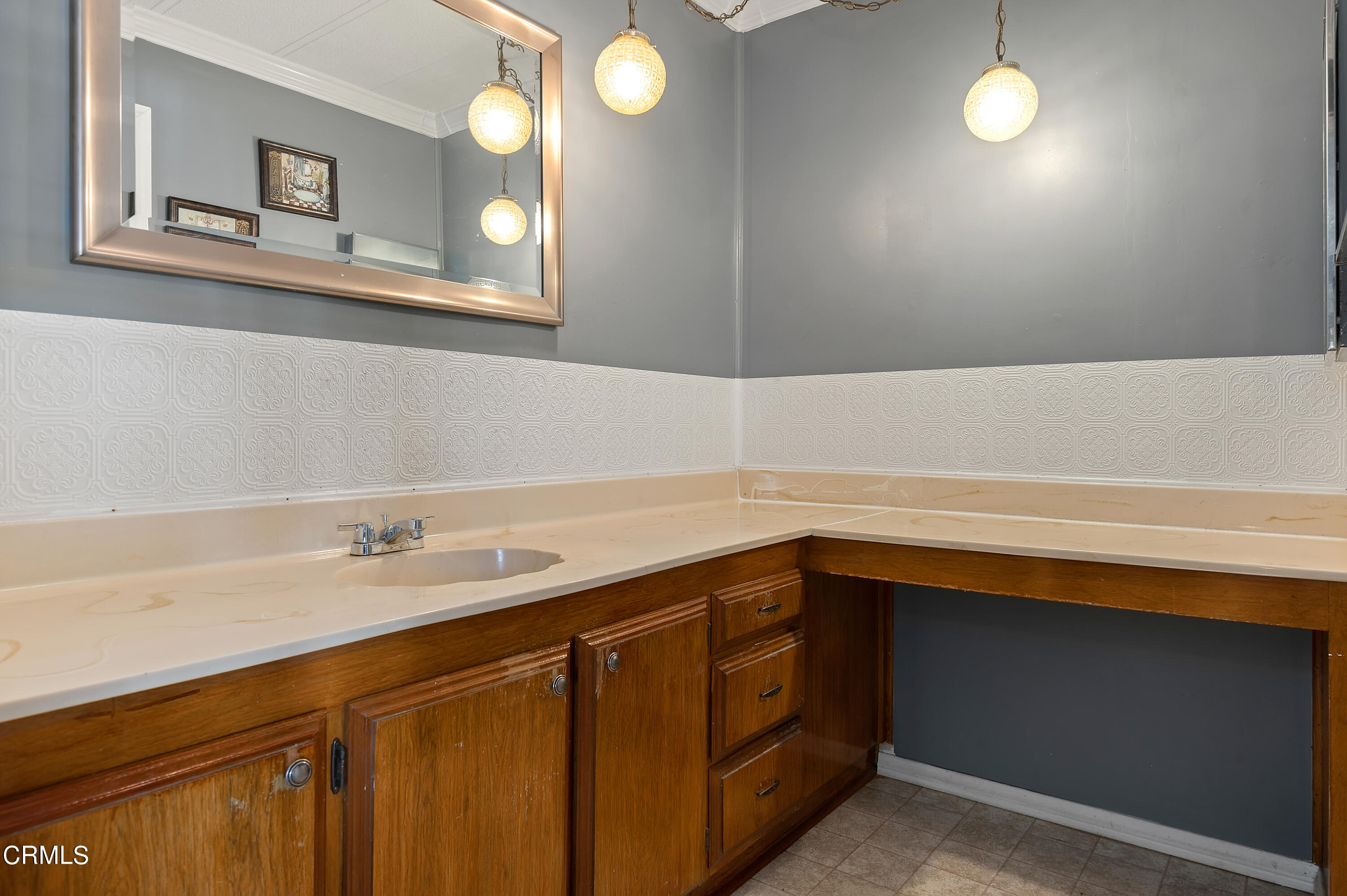 105 Fontana Drive, Unit 3 Oxnard, CA 93033 - Photo 11 of 20 a bathroom with a sink vanity and a mirror