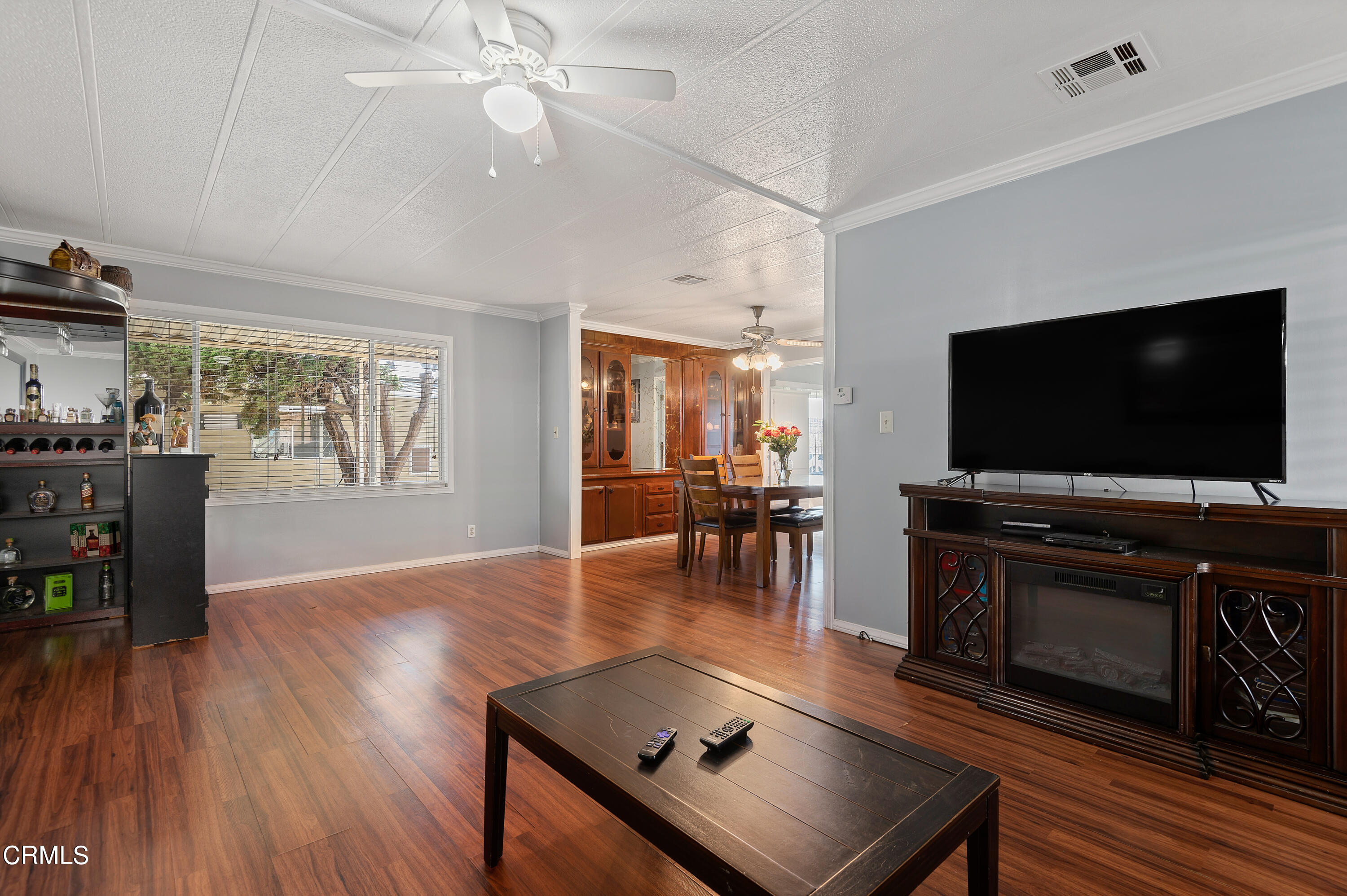 105 Fontana Drive, Unit 3 Oxnard, CA 93033 - Photo 6 of 20 a living room with furniture and a flat screen tv
