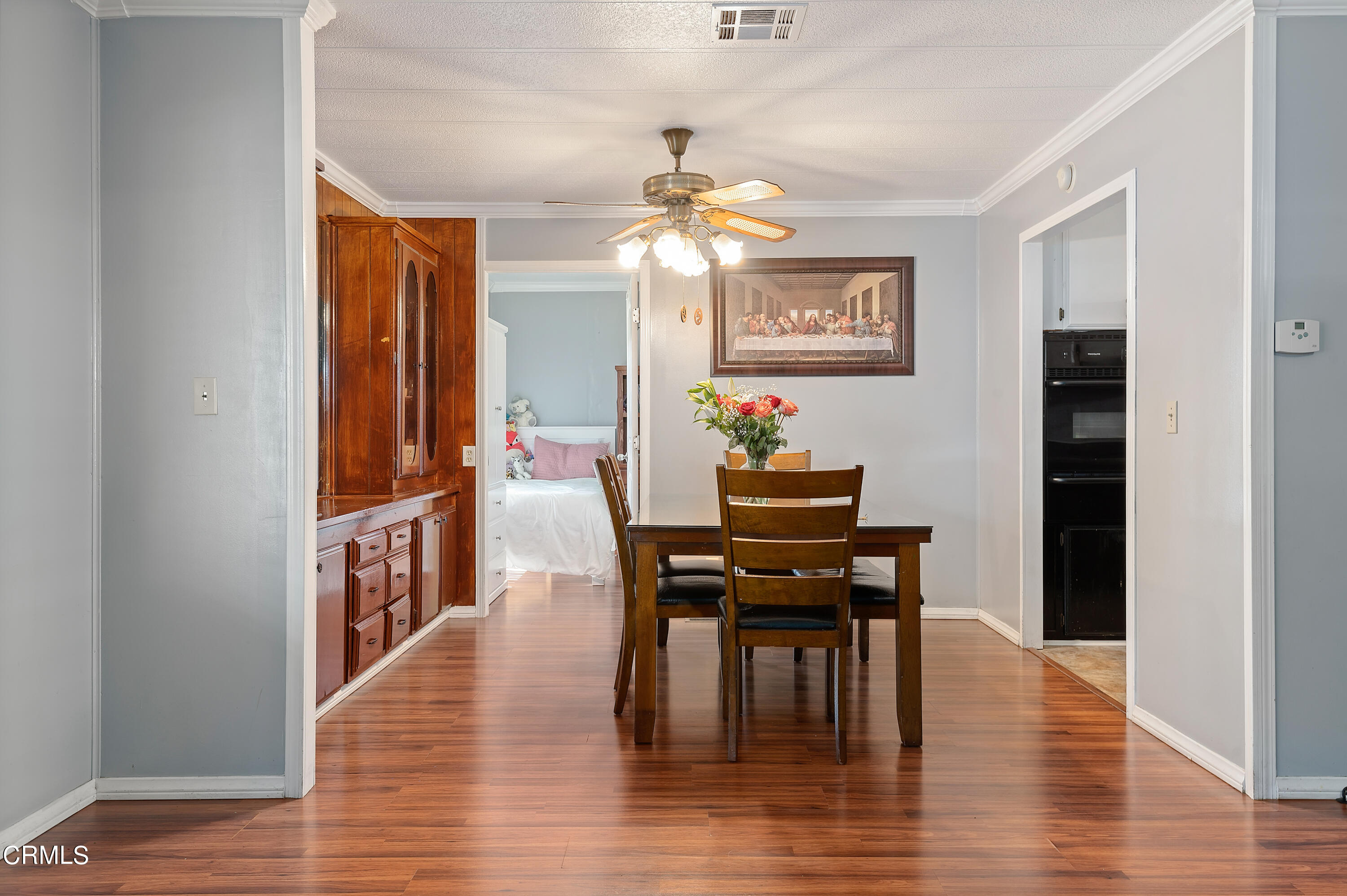 105 Fontana Drive, Unit 3 Oxnard, CA 93033 - Photo 7 of 20 a view of a dining room with furniture and wooden floor