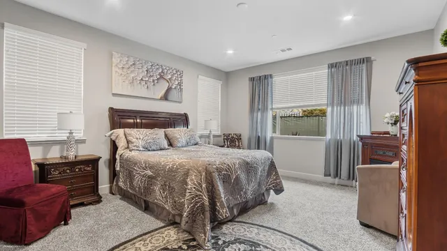 a bedroom with a bed and a couch