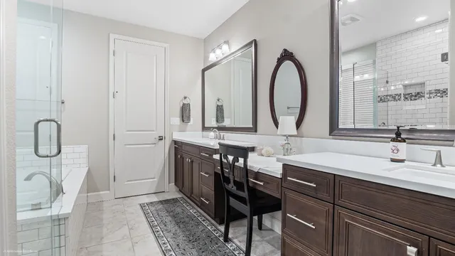 a bathroom with a double vanity sink and a mirror
