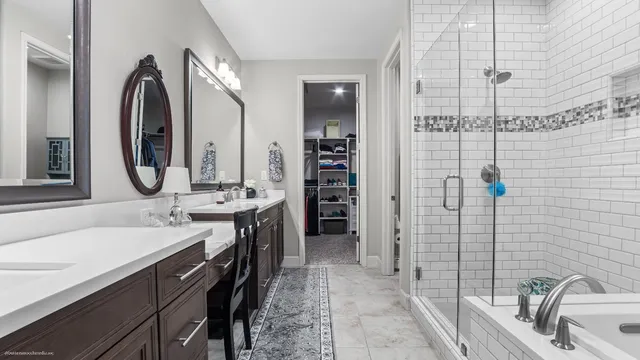 a spacious bathroom with a double vanity sink mirror and double
