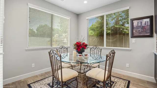 a dining room with furniture and window