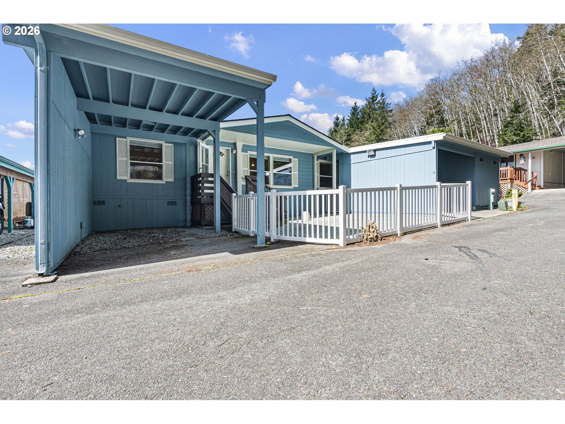 98041 Hallway Road, Unit 41 Brookings, OR 97415 - Photo 2 of 48 a view of a house with a garage
