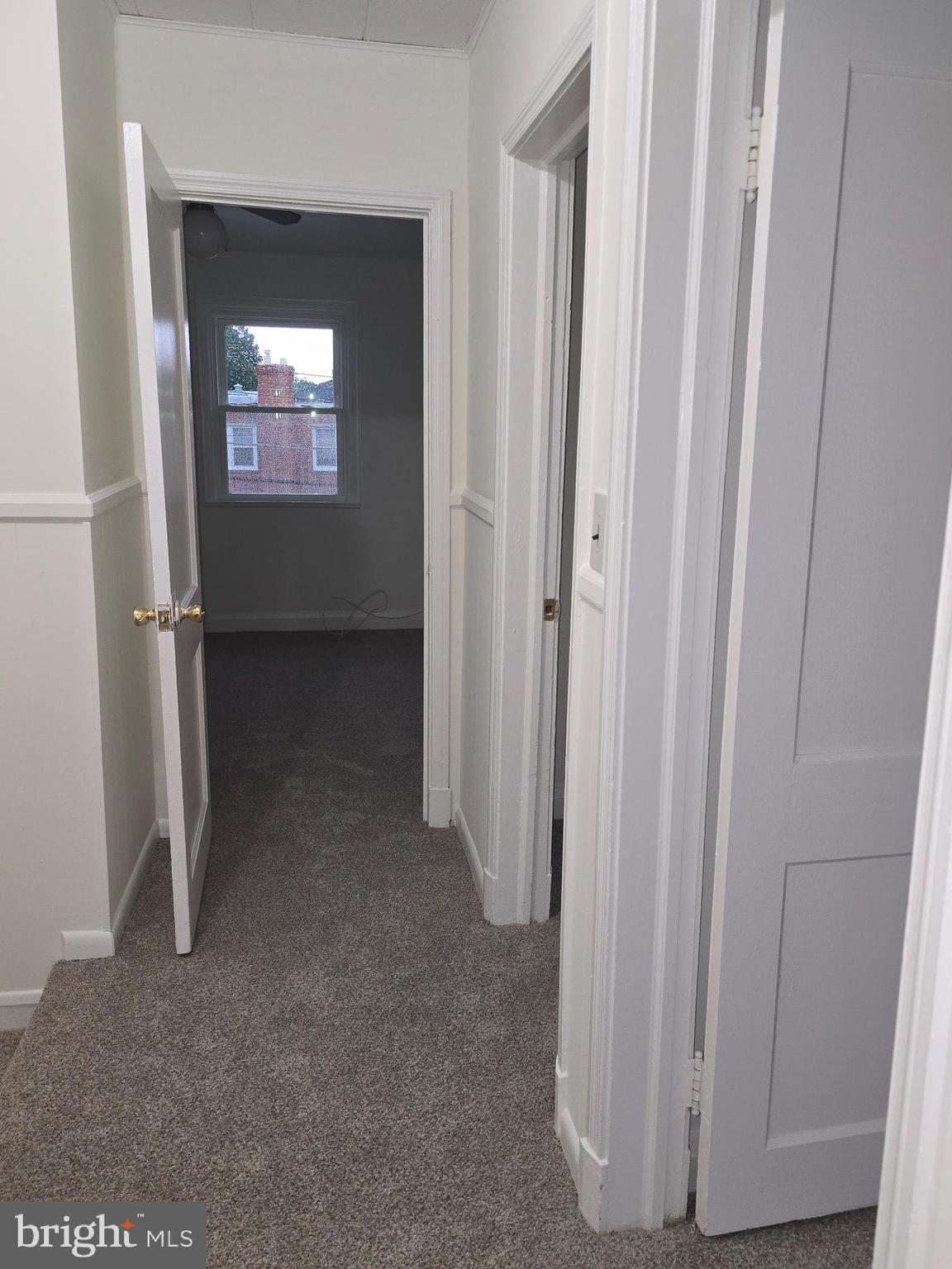 8625 Black Oak Road Baltimore, MD 21234 - Photo 19 of 36 a view of a hallway with wooden floor and a hallway