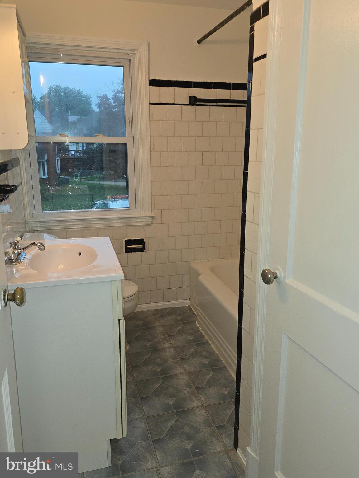 8625 Black Oak Road Baltimore, MD 21234 - Photo 21 of 36 a utility room with a shower and mirror