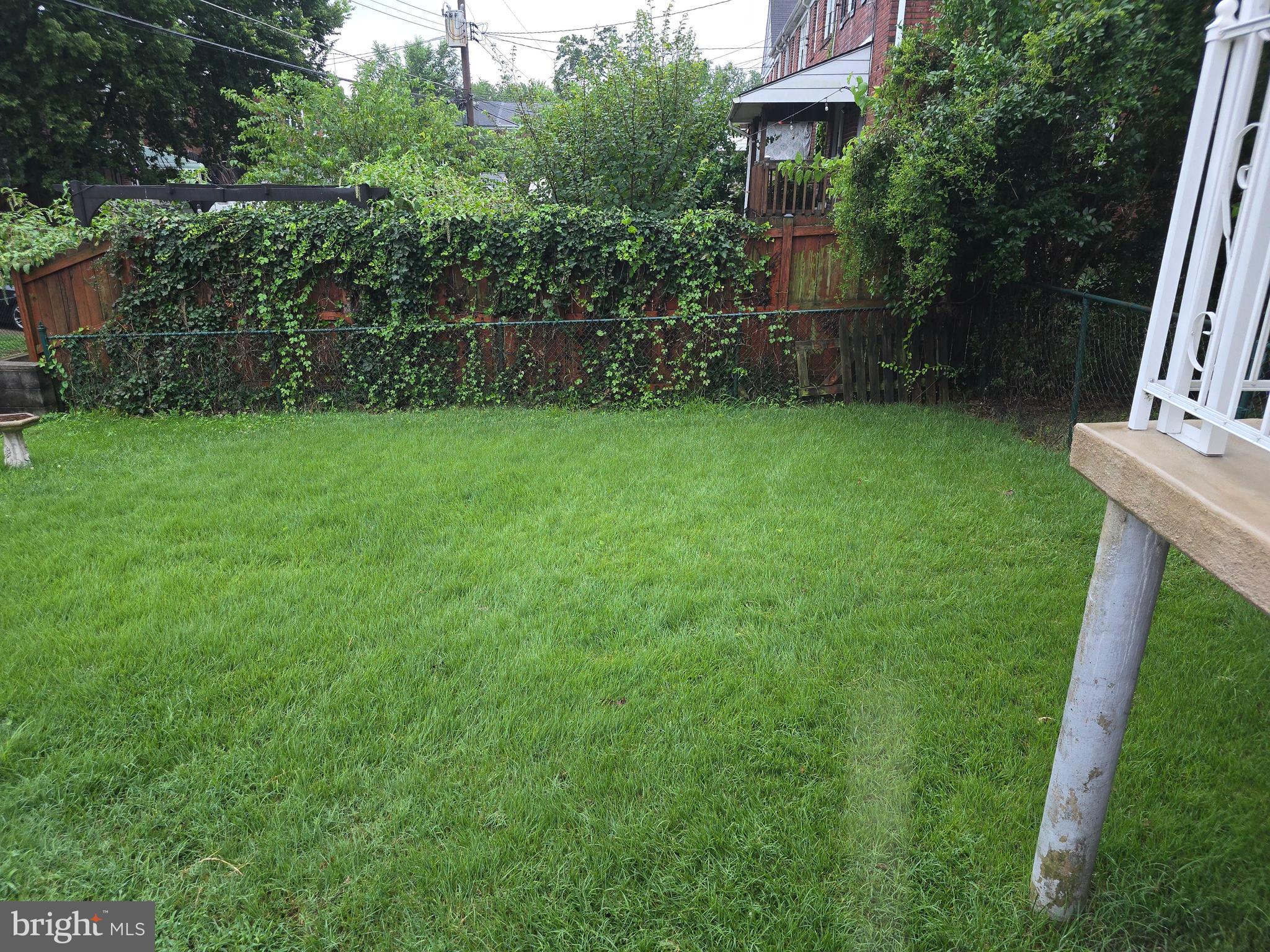 8625 Black Oak Road Baltimore, MD 21234 - Photo 36 of 36 a view of yard with green space and wooden fence