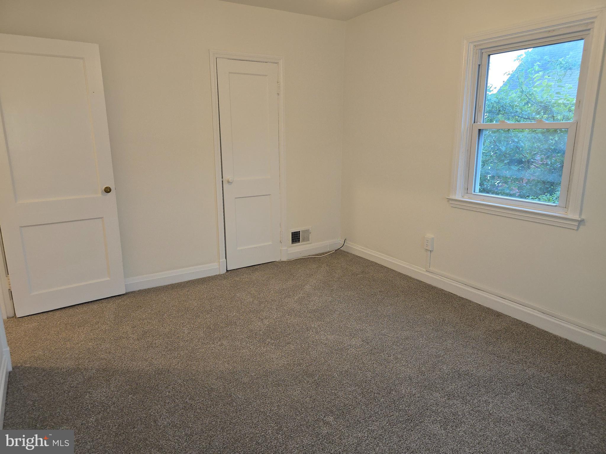 8625 Black Oak Road Baltimore, MD 21234 - Photo 7 of 36 an empty room with a window