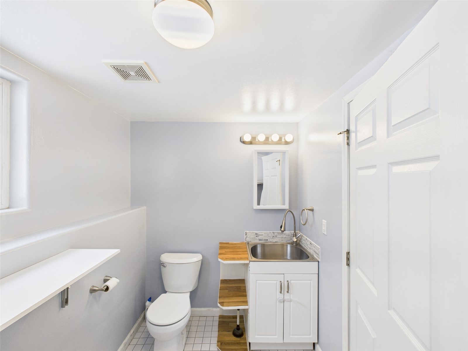 1023 North Adams Street Republic, WA 99166 - Photo 15 of 33 a bathroom with a sink a toilet and shower