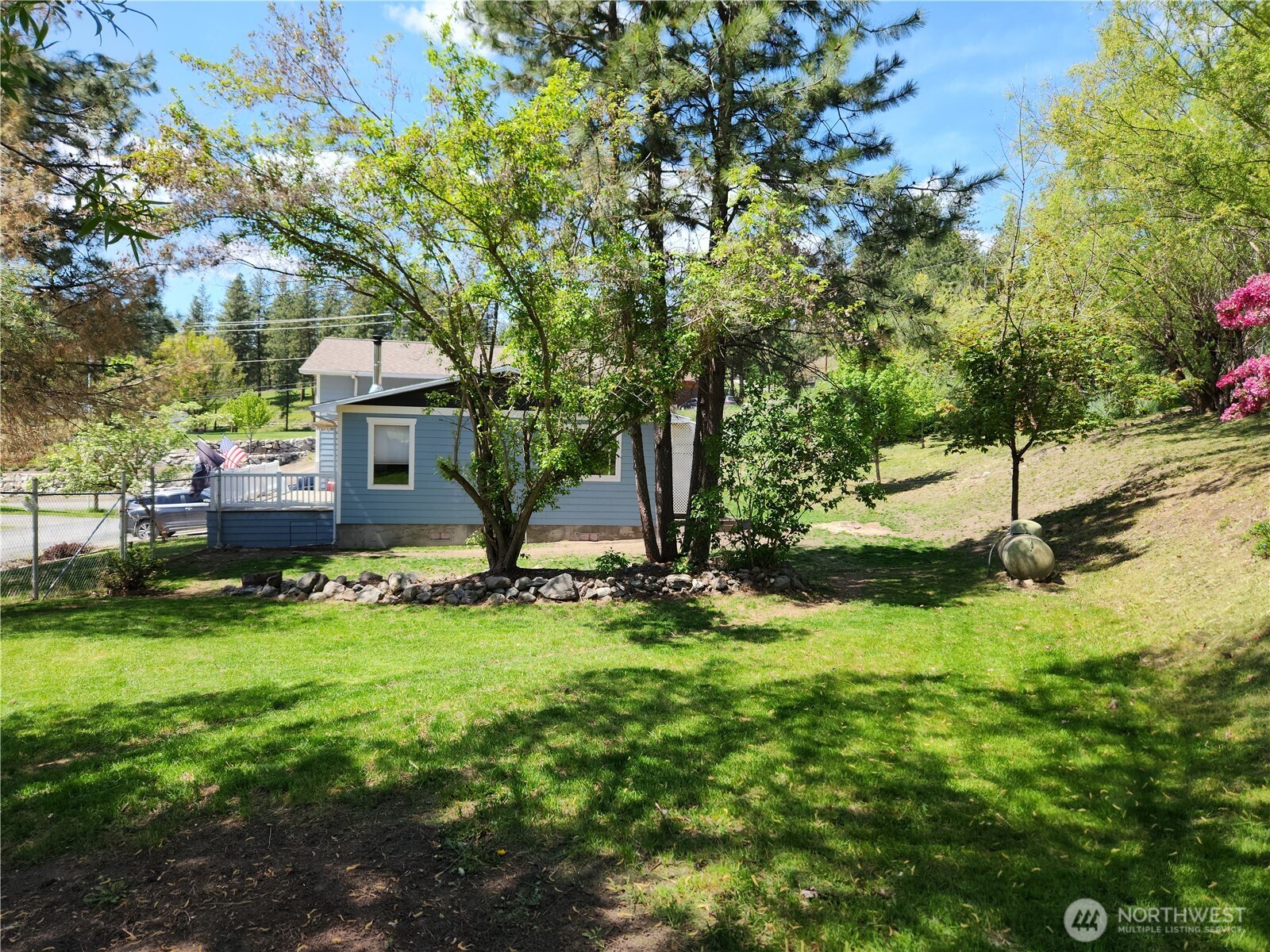 1023 North Adams Street Republic, WA 99166 - Photo 28 of 33 a front view of a house with garden