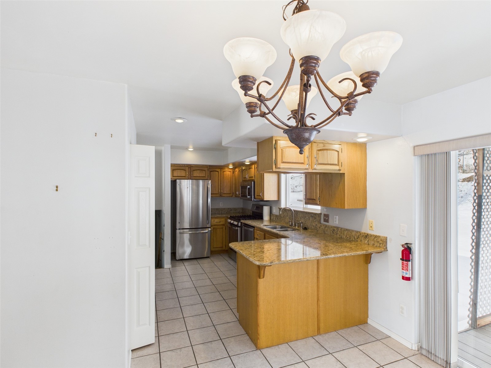 1023 North Adams Street Republic, WA 99166 - Photo 5 of 33 a view of a kitchen with a sink cabinets and a chandelier