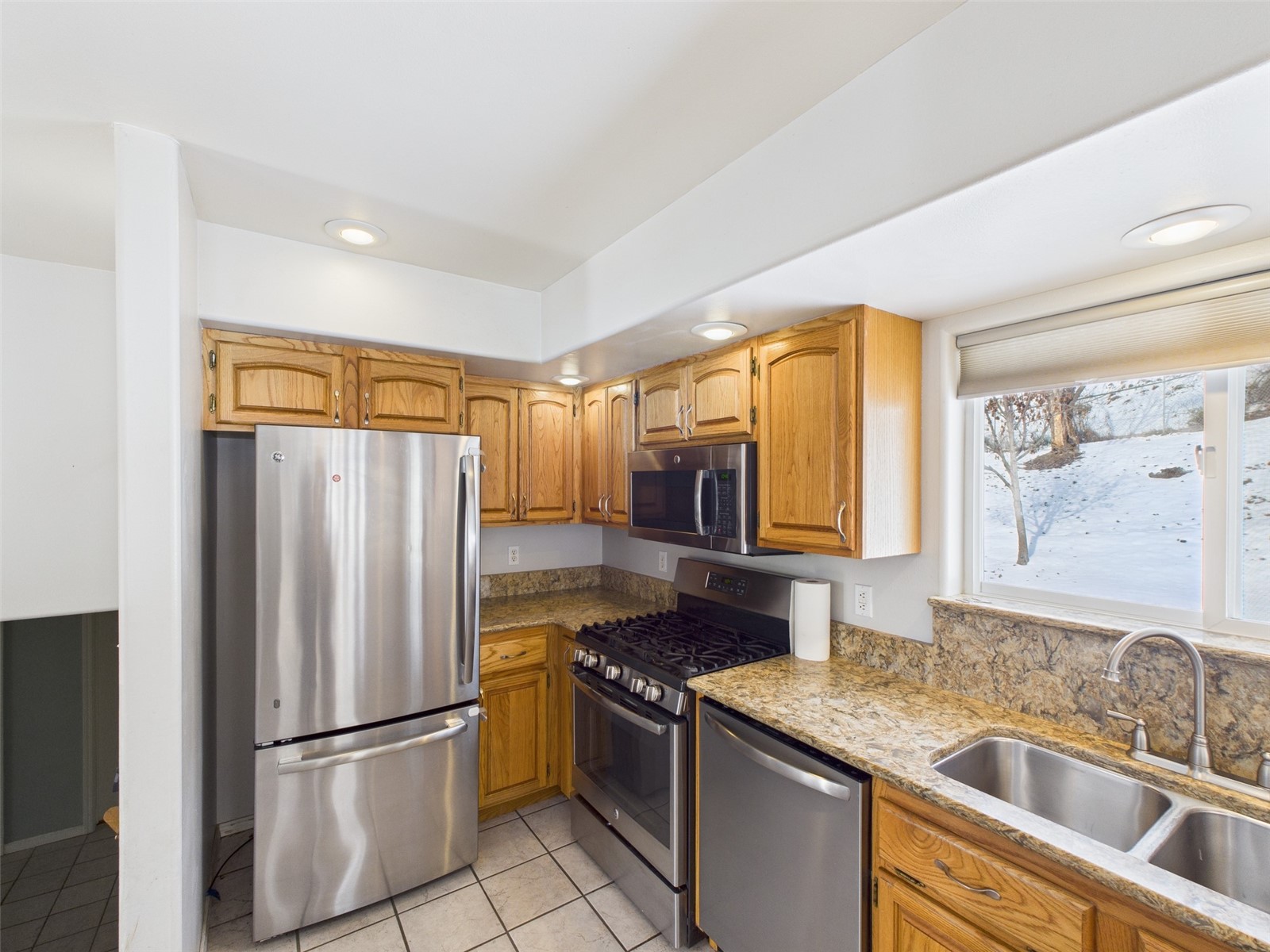 1023 North Adams Street Republic, WA 99166 - Photo 7 of 33 a kitchen with stainless steel appliances granite countertop a refrigerator and a sink