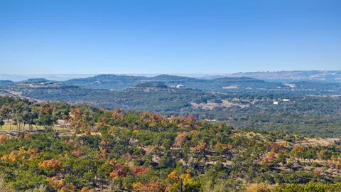 an aerial view of residential house and green space