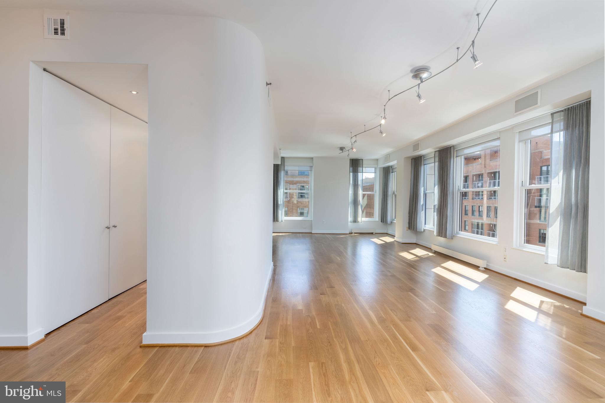 675 E Street Northwest, Unit 900 Washington, DC 20004 - Photo 16 of 46 Living room, butler's pantry on left