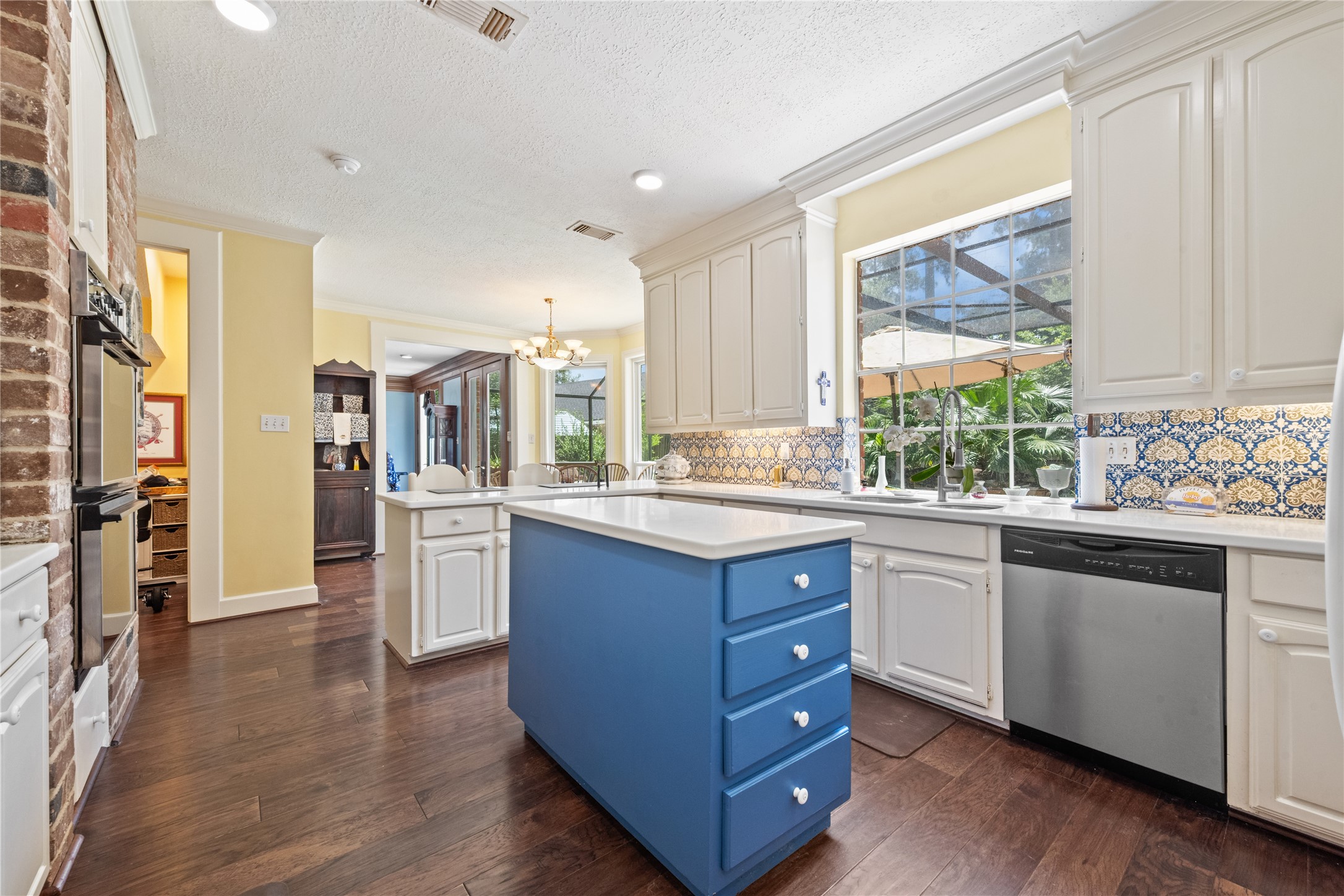 7639 Post Bridge Road Spring, TX 77389 - Photo 14 of 42 a large kitchen with stainless steel appliances granite countertop a large window a sink and cabinets