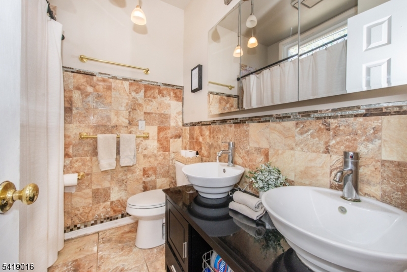 25 Lake Road Denville, NJ 07834 - Photo 18 of 45 a bathroom with a sink toilet and shower