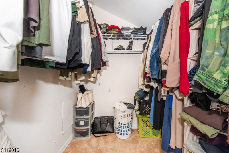 25 Lake Road Denville, NJ 07834 - Photo 21 of 45 a view of walk in closet with clothes and shoes