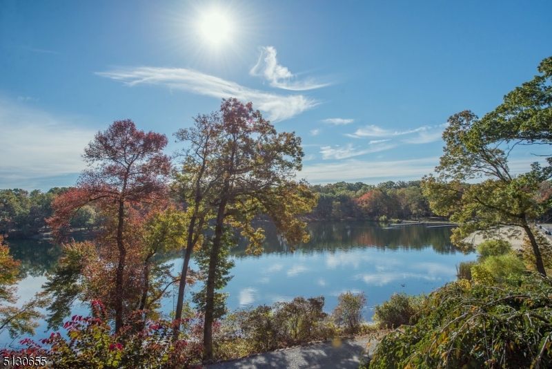 25 Lake Road Denville, NJ 07834 - Photo 22 of 45 a view of a lake in between two of trees