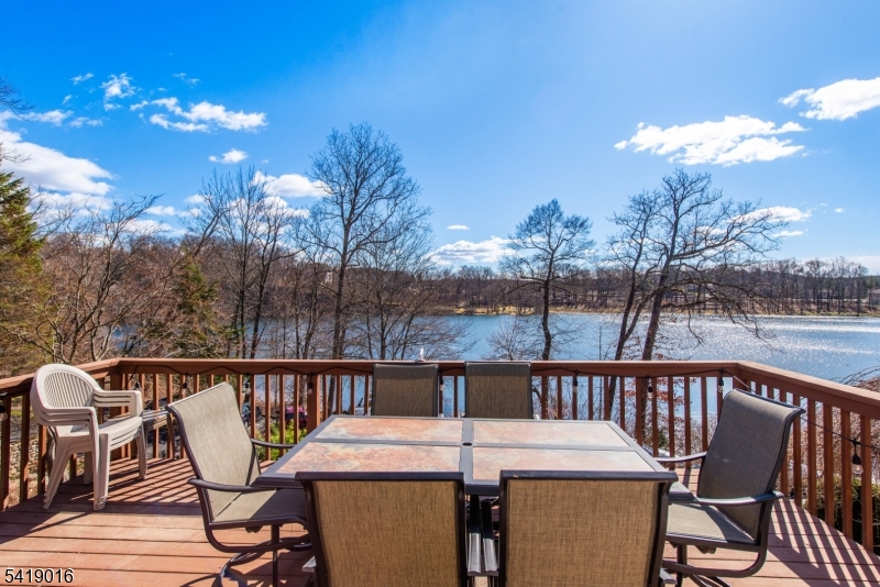 25 Lake Road Denville, NJ 07834 - Photo 38 of 45 a view of a balcony with dining table and chairs